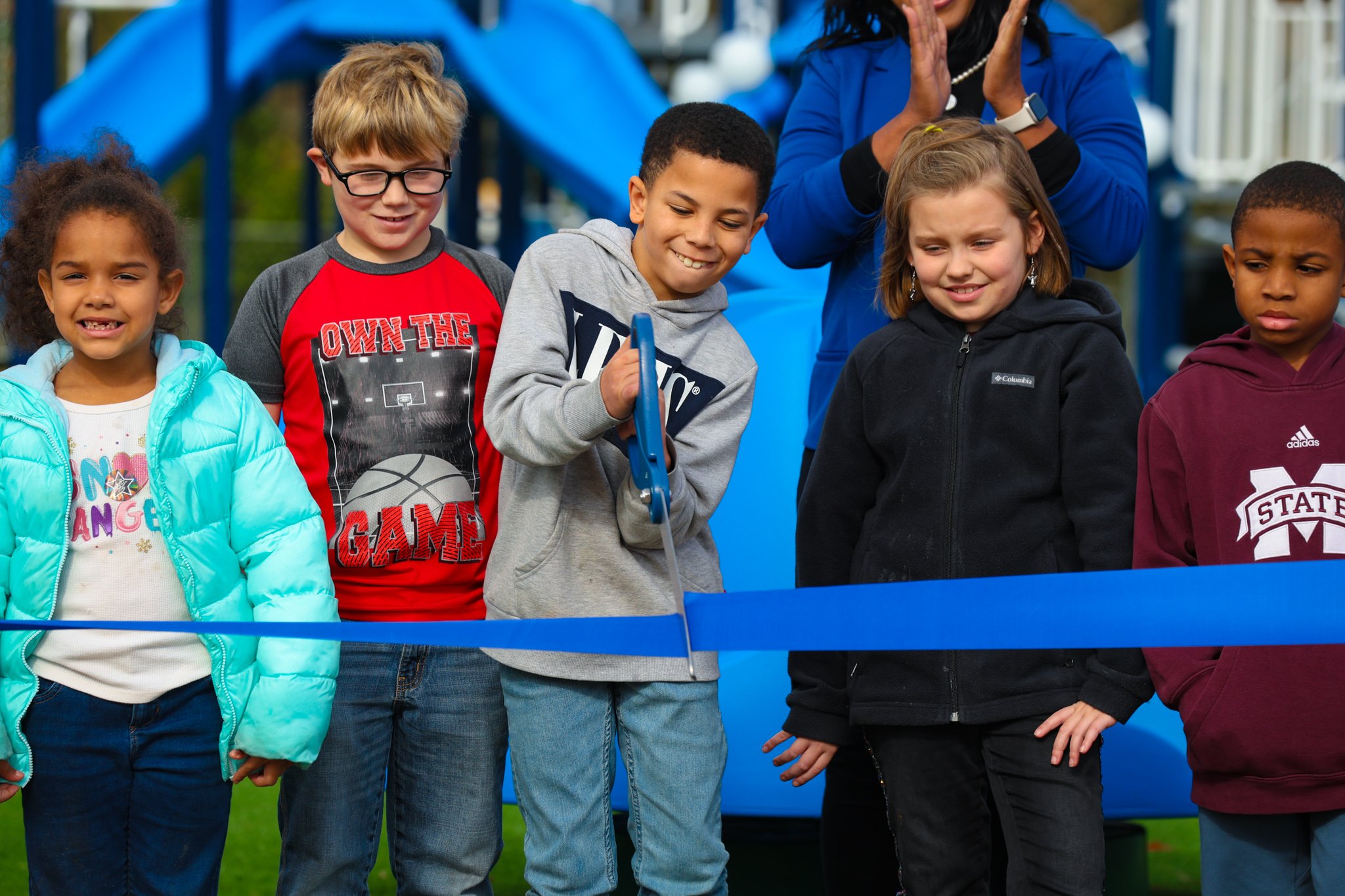 Kids at IMPACT Parks BCBS ribbon cutting ceremony for new park