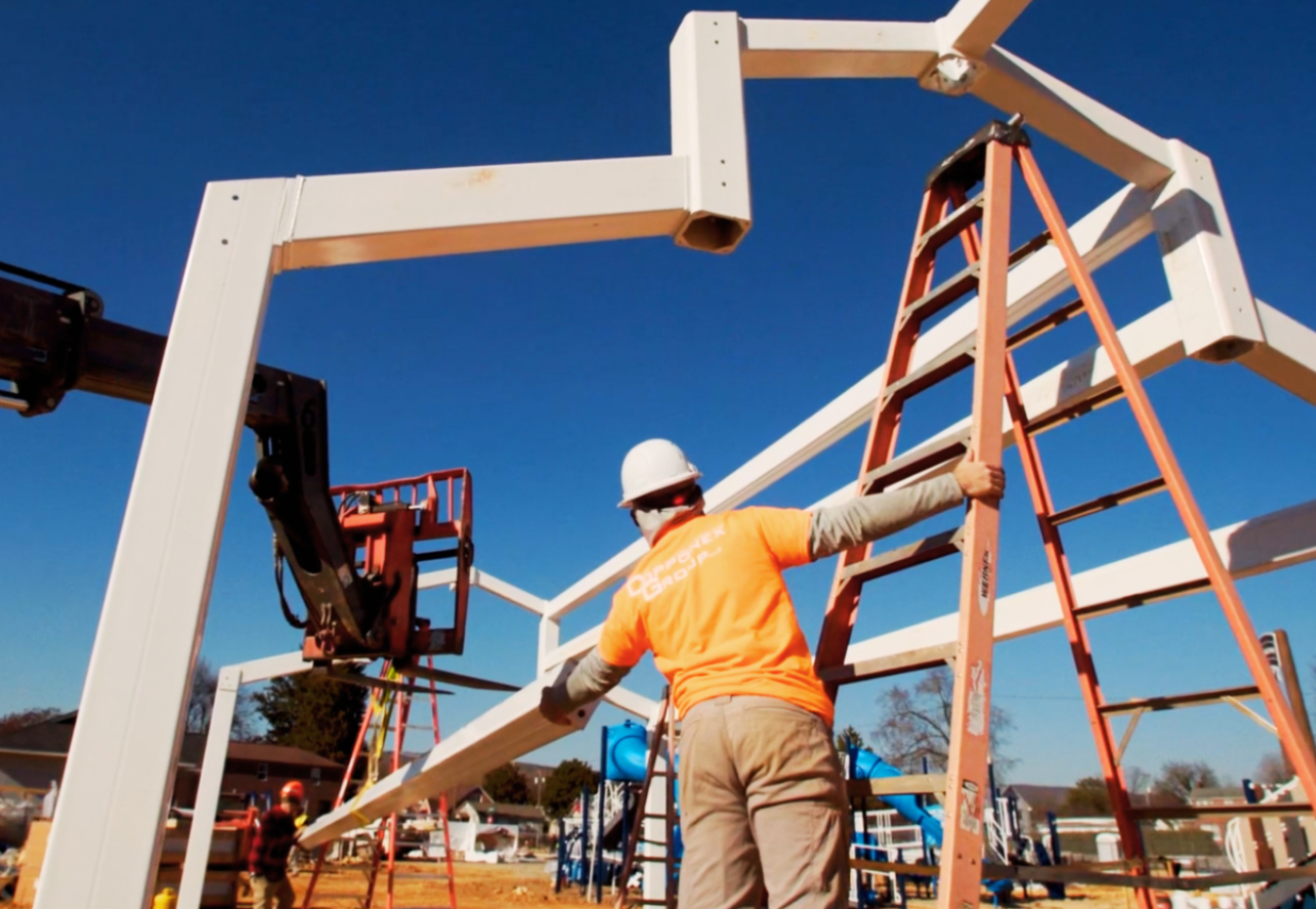 IMPACT Parks Playground Construction man on ladder