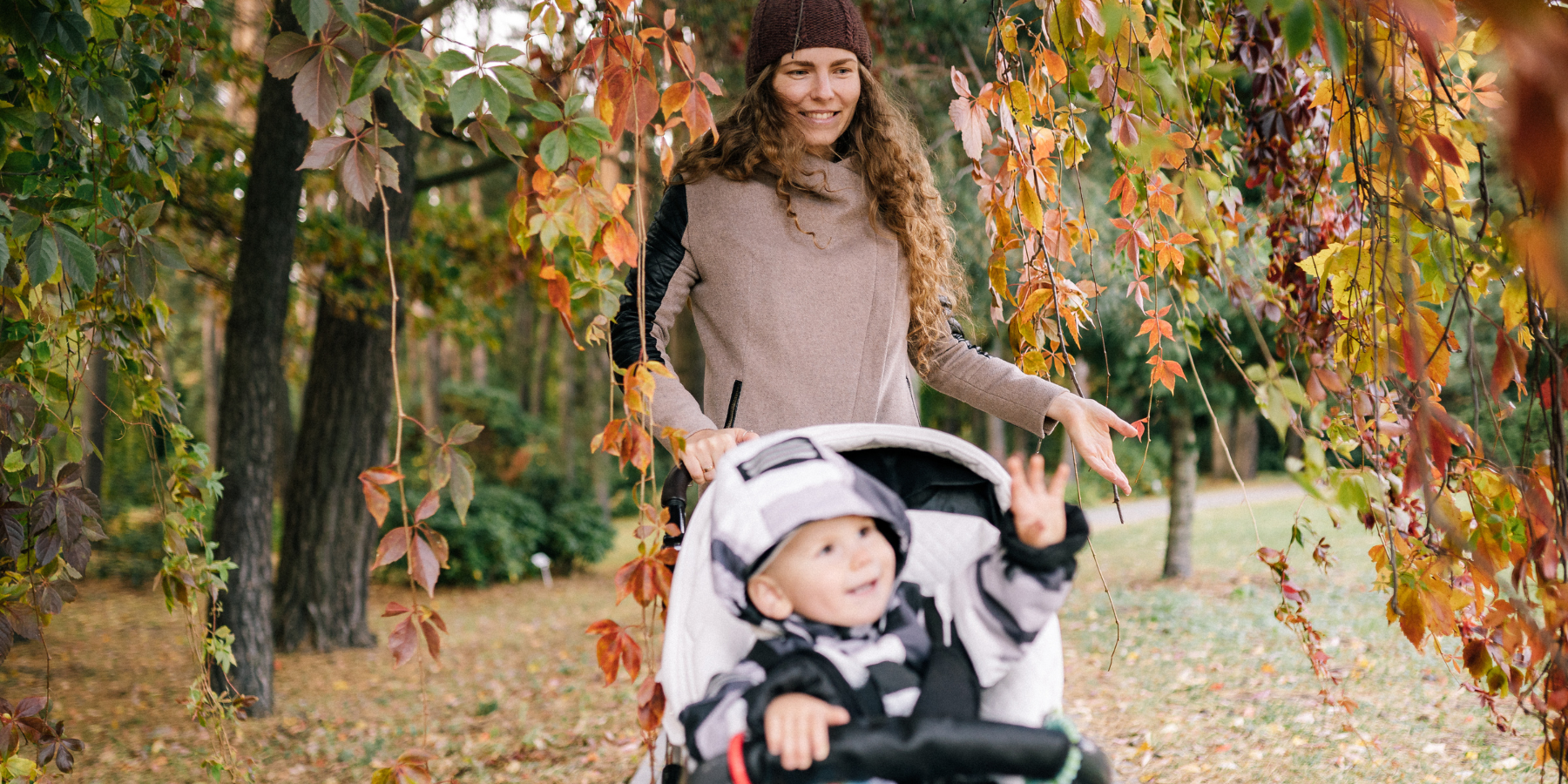 Mother and Child in Park During Autumn