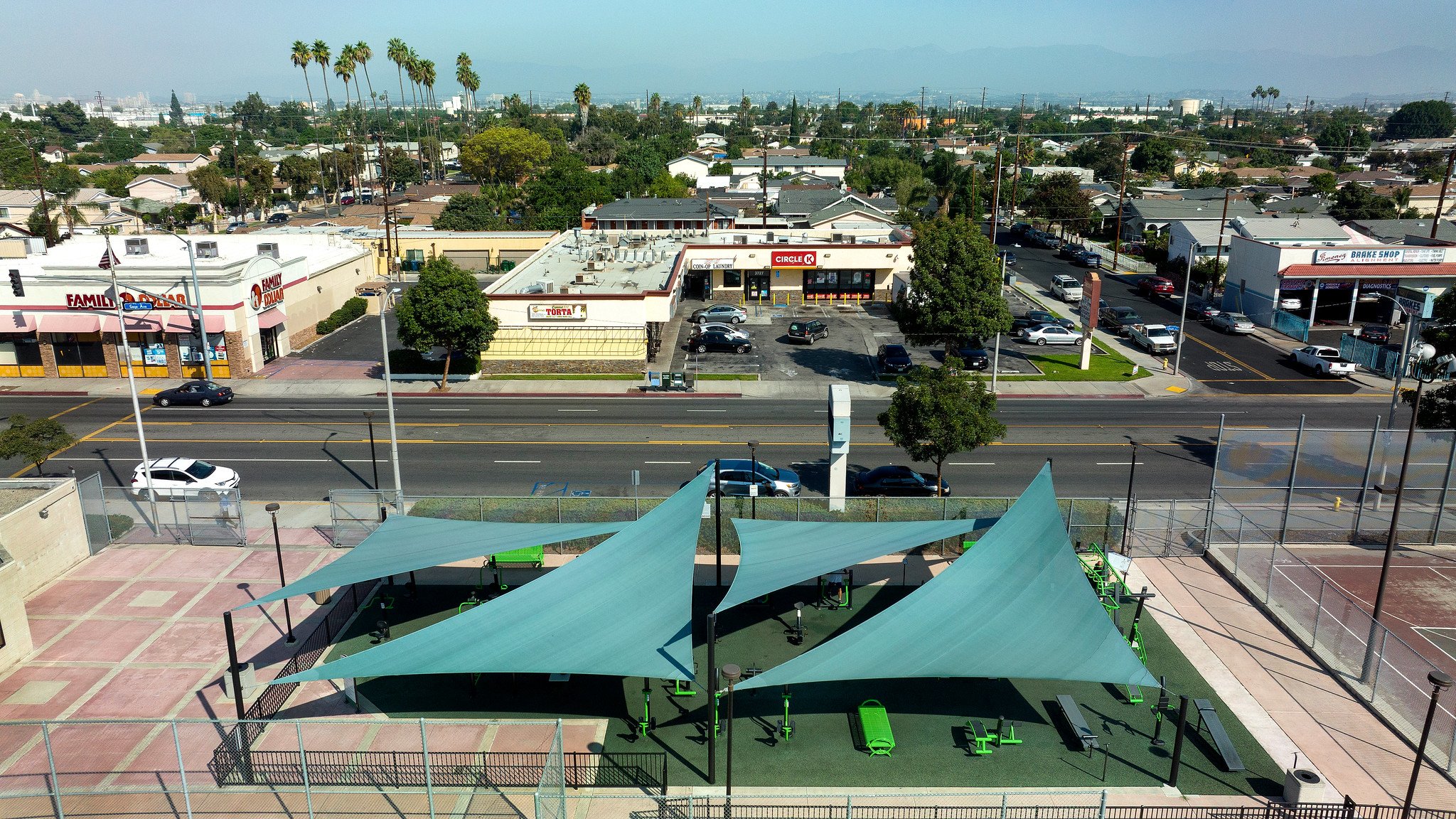 Outdoor fitness center nestled between businesses in urban community