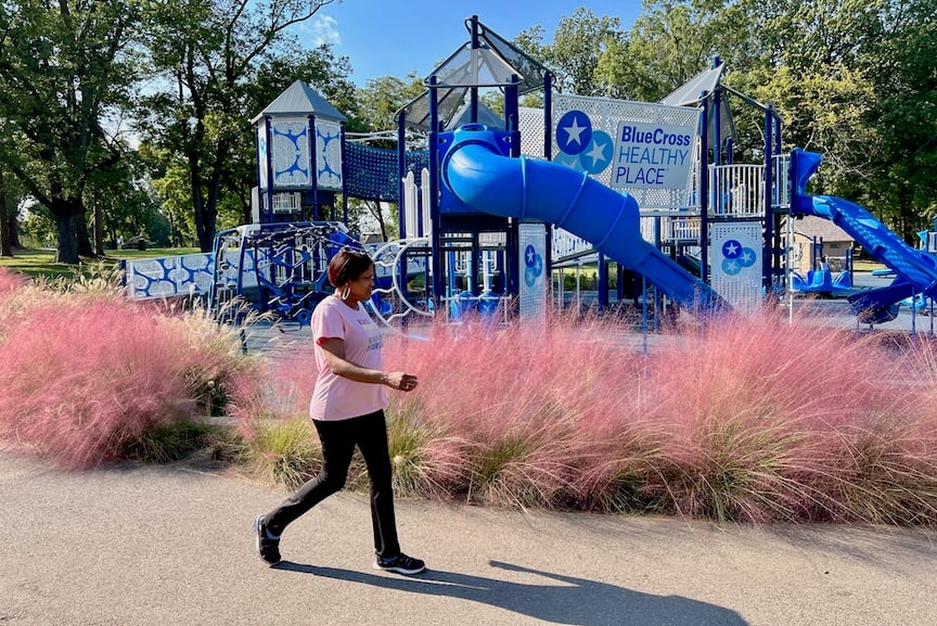 Woman walking at IMPACT Parks and BCBS's playground