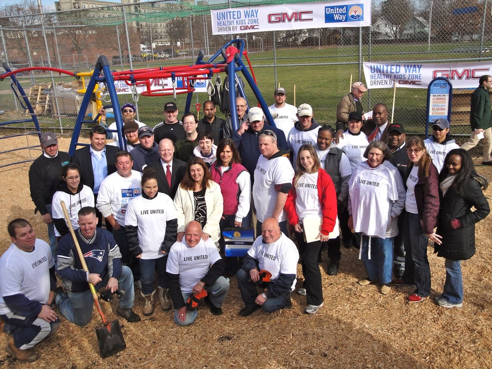 People gathered in front of a playground