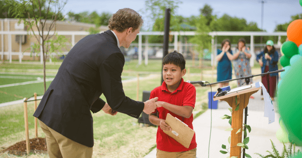 Student shaking hand after speaking at TPL park ribbon cutting ceremony