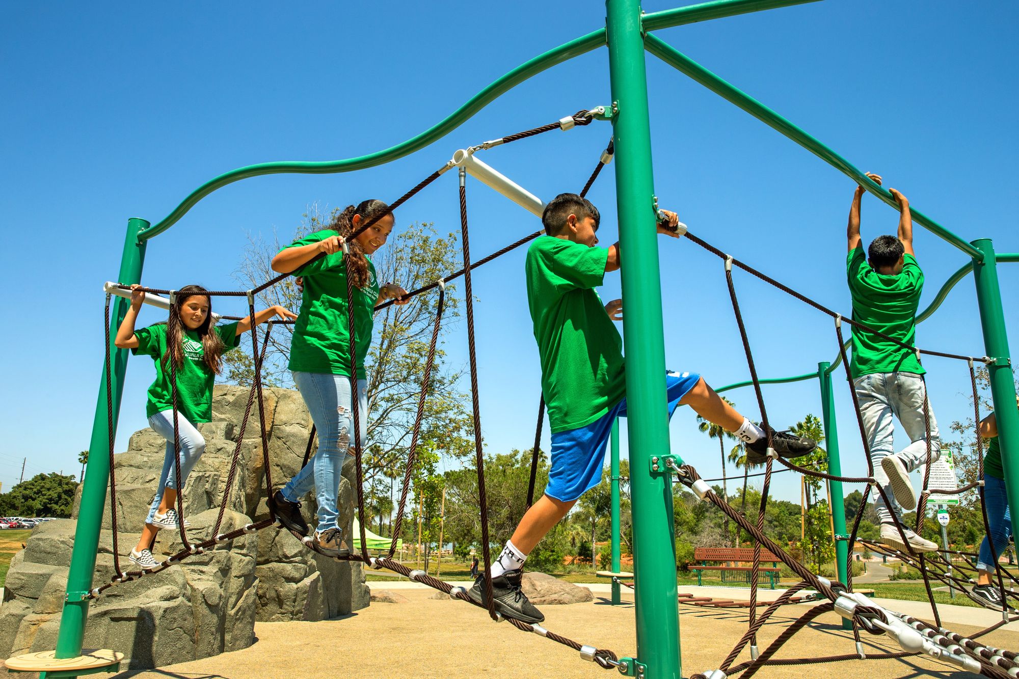 Kids climbing on ropes course at Keiser Permanente Park