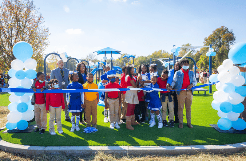 Community celebrating the grand opening of IMPACT Parks project