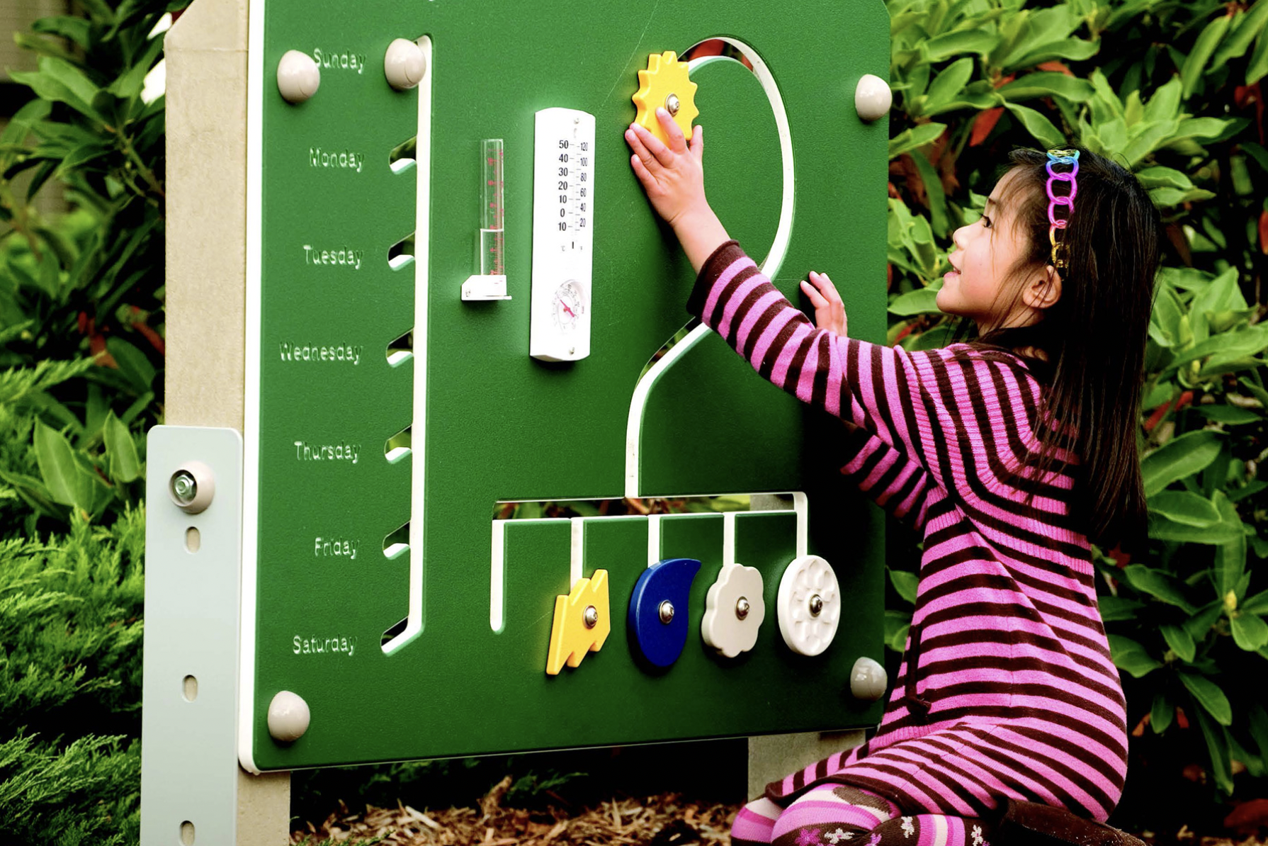 Girl using sensory board from PlayCore 