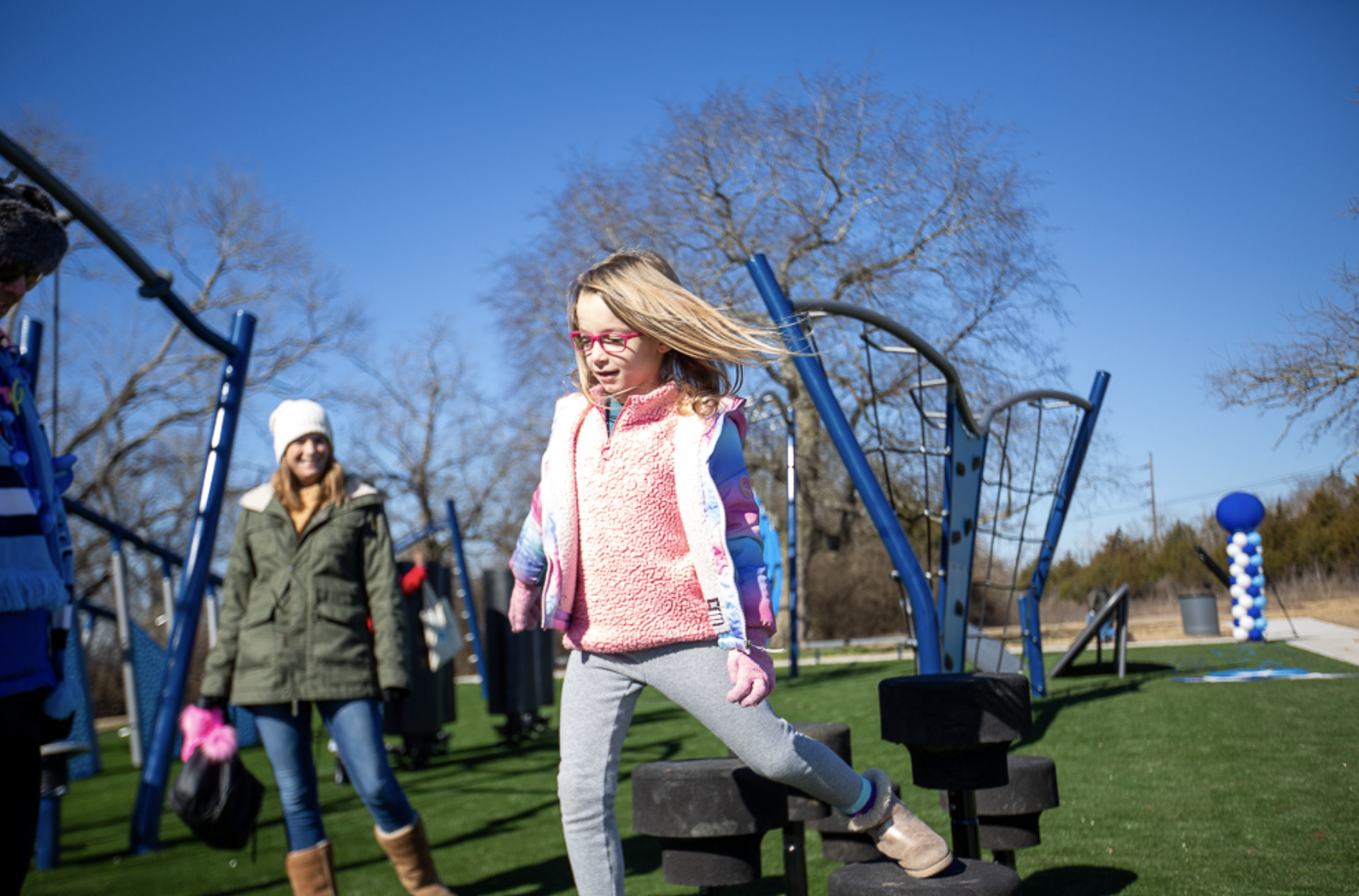 Girl running and playing at outdoor YMCA park