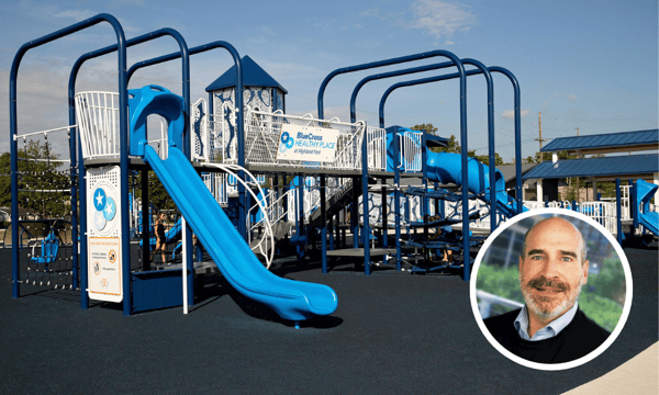 BlueCross healthy place play structure with a photo of Kent Callison
