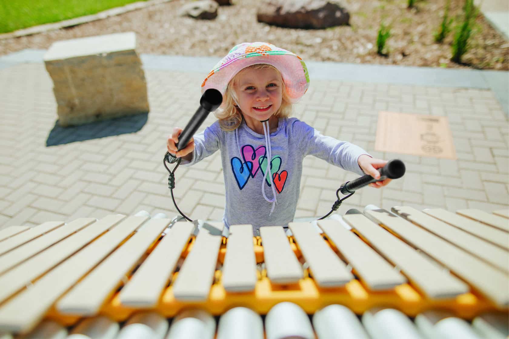 Freenotes Harmony Park little girl playing with xylophone